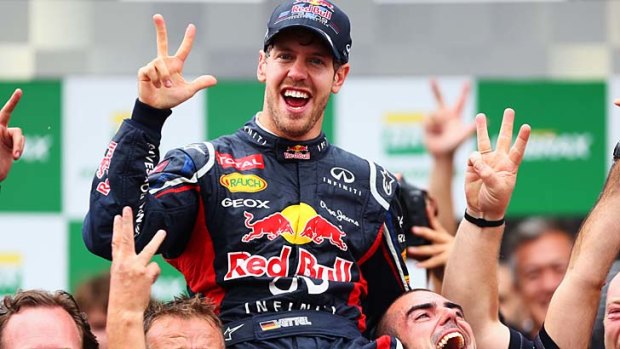 Three-peat &#8230; Red Bull's Sebastian Vettel celebrates his third straight drivers' championship after finishing sixth in a thrilling climax to the season in Sao Paolo.