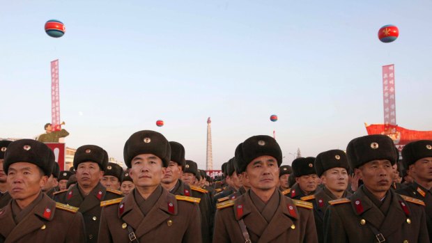 Military personnel gather at Kim Il Sung Square on Friday in a show of support for North Korea's latest missile test.