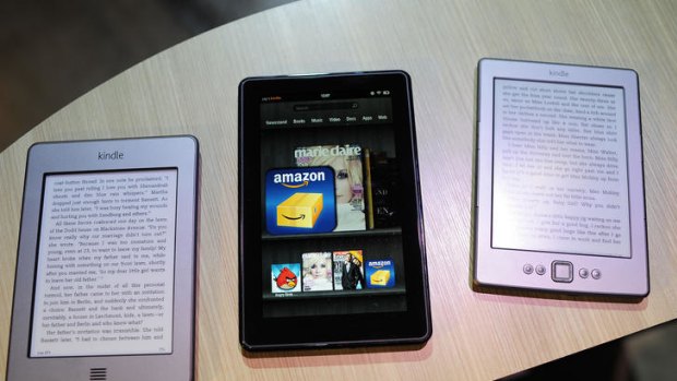 New Amazon Kindle products (L-R), Kindle Touch, Kindle Fire tablet and new Kindle.
