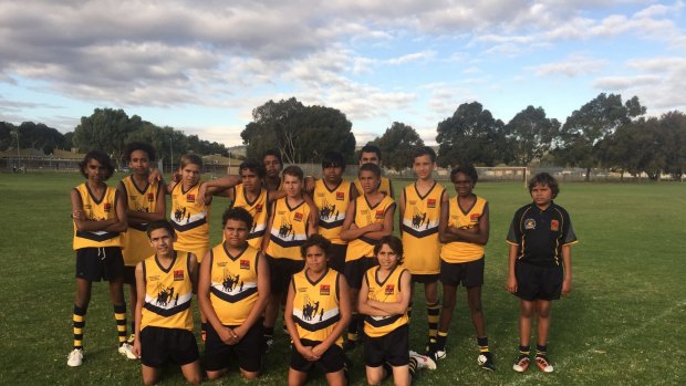 Elijah Doughty (third from left) with a Goldfields Football Academy team in Kalgoorlie.
