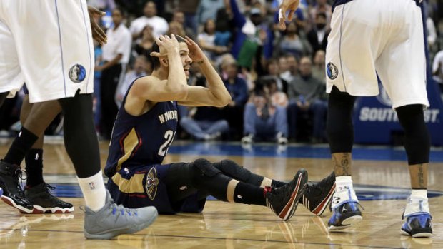New Orleans Pelicans guard Austin Rivers reaches to his head with his hands after looking for a foul call against the Dallas Mavericks as time ran in the second half in Dallas. The Mavericks won 110-107.