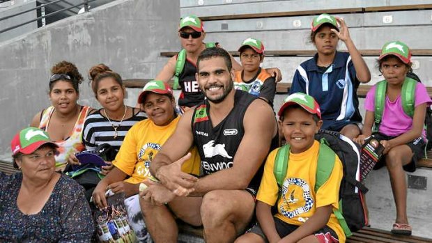 Adored: Inglis with a group of indigenous kids from Goodooga.