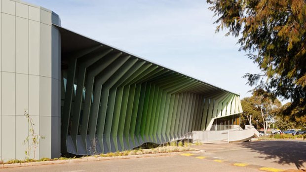 Steel blades shield a glass wall and bring a striking contemporary look to the KIOSC centre.
