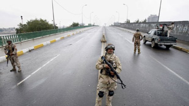 Iraqi soldiers man a checkpoint in central Baghdad in 2007.