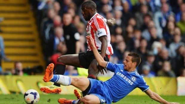 Penalty call: Cesar Azpilicueta (R) of Chelsea tangles with Sunderland striker Jozy Altidore.