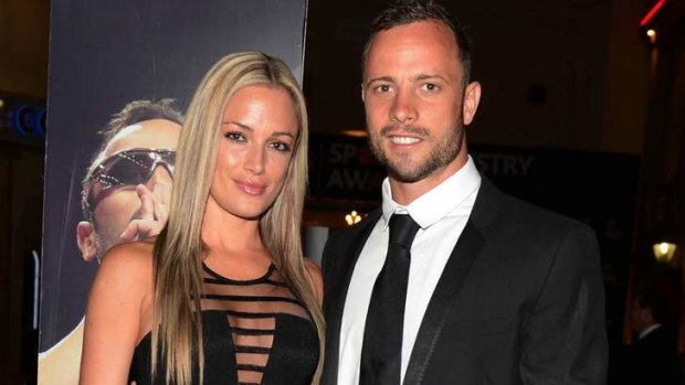 Oscar Pistorius  and his girlfriend Reeva Steenkamp pose for a picture in Johannesburg on February 7.