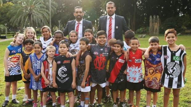 Adam Goodes and Lance Franklin promote the AFL’s indigenous round with children wearing each clubs’ indigenous jumper.