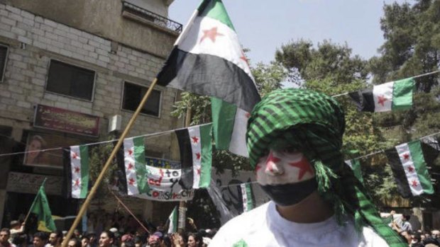 Demonstrators take part in a protest against the Assad regime in Yabroud, near Damascus, yesterday.