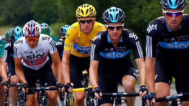 Sky high: Tour leader Bradley Wiggins with teammates, including Australian Michael Rogers (second right).