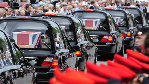 Killed in action ... hearses carry the bodies of five British soldiers through the small town of Wootton Bassett.
