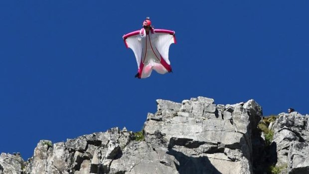 Switzerland's Geraldine Fasnacht leaps from a mountain in France to fly in a wingsuit.
