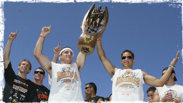 Career highlight No.1: Robbie Farah and Wests Tigers teammate Benji Marshall hold aloft the 2005 NRL premiership trophy.