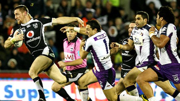 Warrior Brent Tate slips away from Billy Slater in Auckland earlier this year. Next season he heads to Queensland.