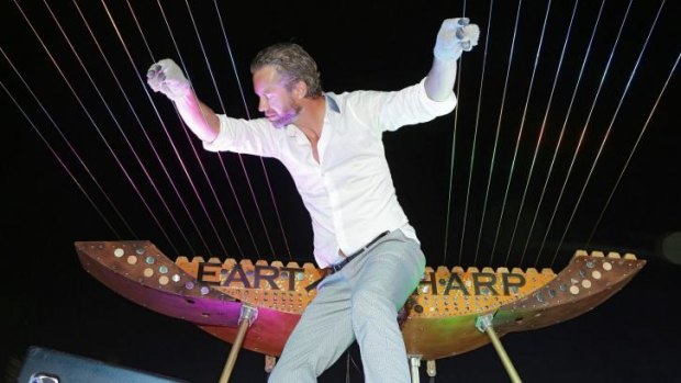 Strings attached ... William Close performs on his monstrous harp in Grenada in April, 2014.