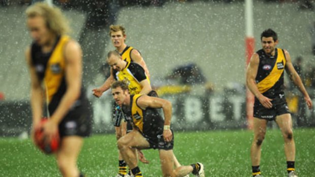 Tiger Ben Nason lines up for goal as hail hammers down at the MCG during Richmond's clash with Adelaide.