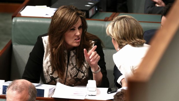Peta Credlin, chief of staff to Prime Minister Tony Abbott, in discussion with Foreign Affairs Minister Julie Bishop inside Parliament House in June.