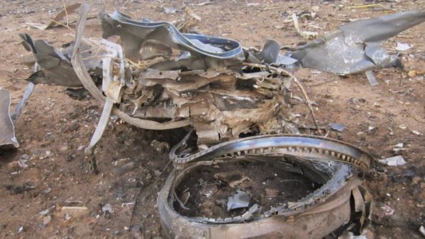 Debris is seen at the crash site of Air Algerie flight AH5017 near the northern Mali town of Gossi.