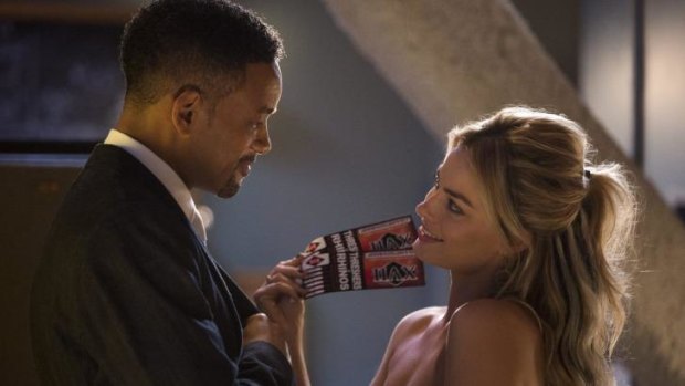 Top spot: Will Smith and Margot Robbie in <i>Focus</i>, the number one movie for the weekend.