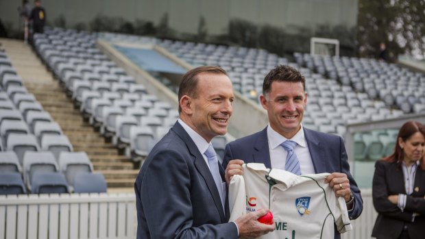 Prime Minister's XI captain Mike Hussey, at Manuka Oval with Prime Minister Tony Abbott, has hit out at criticism of Michael Clarke.