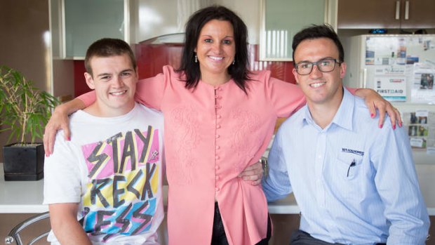 Lambie with her sons Dylan, left, and Brentyn at their home in Burnie.