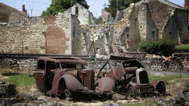 Remains: A photo taken on June 10, 2006 shows the remains of cars at the partially destroyed village of Oradour-sur-Glane.