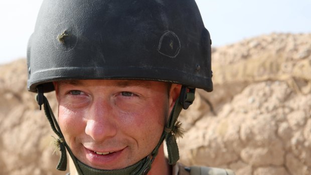 Lucky soldier ... a handout image from the UK's Ministry of Defence shows Private Leon Wilson, a Territorial Army soldier on attachment to 2nd Battalion, the Mercian Regiment (Worcesters and Foresters), wearing his helmet pierced by a Taliban bullet.