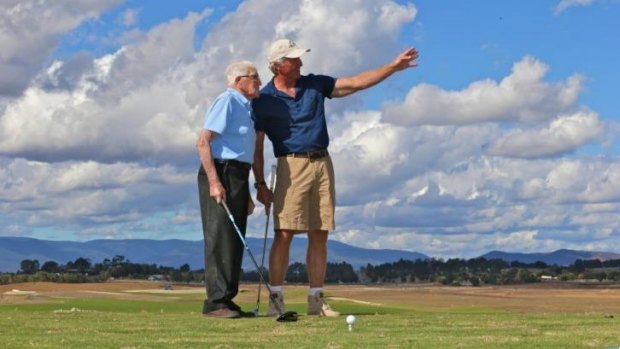 On course: Les Smith, 99,  hitting a ceremonial opening tee shot alongside Greg Norman at the new Eastern Golf Club. 