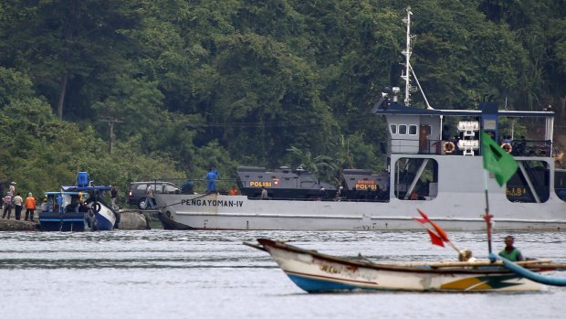 Armoured police vehicles carrying the two Australian prisoners are unloaded from a ferry on the prison island of Nusakambangan.