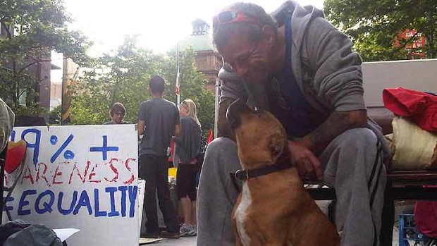 Peter Williams and his dog Achilles at the protest site this morning.