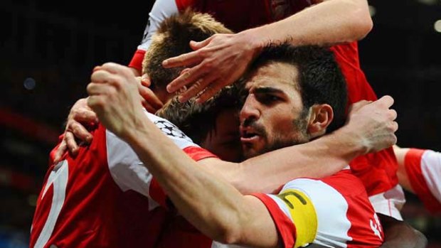 Cesc Fabregas celebrates a goal during the team's Champions League round of 16.