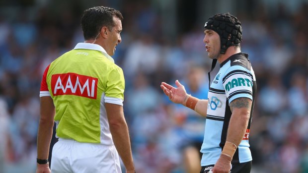 First sign: Cecchin speaks to Michael Ennis during round four last year.