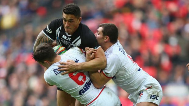 Sonny Bill Williams is held up by Gareth Widdop during the Rugby League World Cup semi-final at Wembley Stadium.