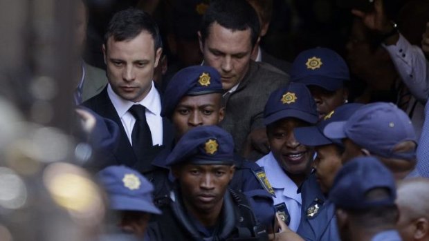 Oscar Pistorius leaves court after being found guilty of culpable homicide.