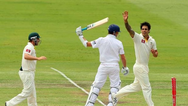 Mitchell Johnson celebrates the wicket of England's Graeme Swann as the Australian side heads towards victory in the third Test at the WACA Ground yesterday.