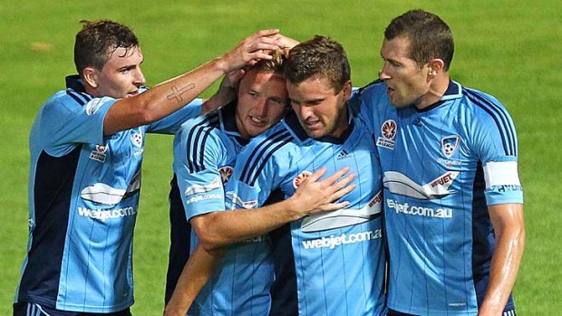 Breakthrough &#8230; Jason Culina, second from right, is swamped after scoring for the Sky Blues against Perth on Saturday night.