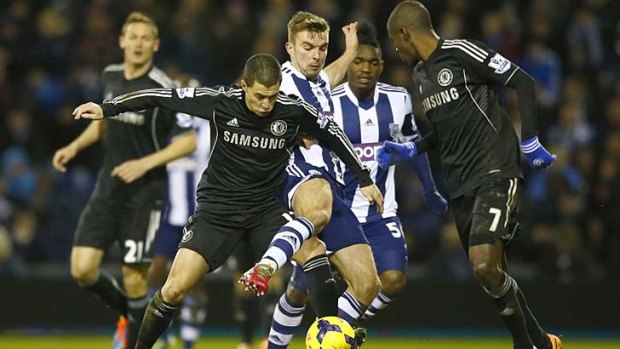 Chelsea's Eden Hazard (L) challenges West Bromwich Albion's James Morrison.