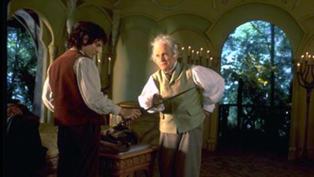 Elijah Wood as Frodo Baggins and Ian Holm as Bilbo Baggins in a still from <i>Lord of the Rings</i>.