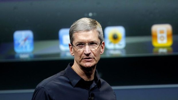 Apple CEO Tim Cook speaks about the iPhone 4S at Apple headquarters in October.