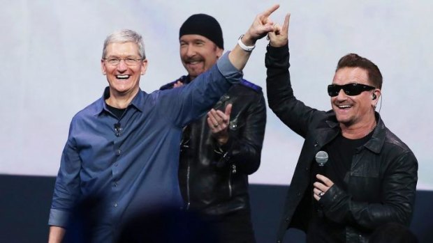 Apple CEO Tim Cook and U2 singer Bono.