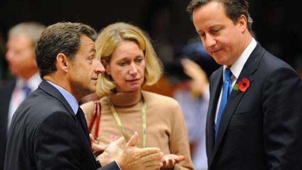Nicolas Sarkozy (left) with David Cameron at the European Council's headquarters in Brussels.