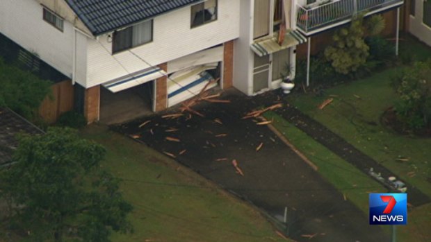 Damage from a tree that exploded after a lightning strike on Wana Street in Sunnybank on Friday afternoon.