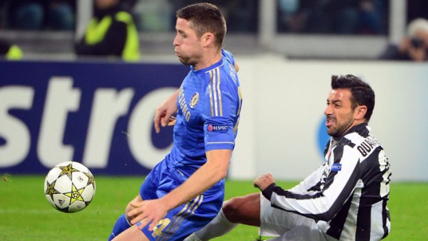 Juventus forward Fabio Quagliarella fights for the ball with Chelsea defender Gary Cahill.