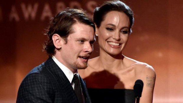 Jack O'Connell accepts the New Hollywood Award for <i>Unbroken</i> from actress Angelina Jolie