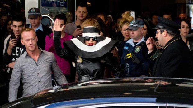 Crush on you ... screaming fans surrounded Lady Gaga as she left her CBD hotel on Thursday.
