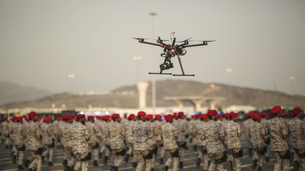 A drone is used to record a military parade by Saudi security forces in preparation for the annual hajj pilgrimage in Mecca, in 2015.