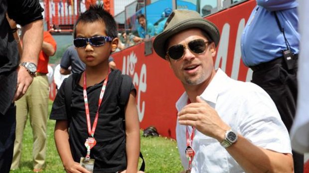 Special time ... Brad Pitt and Maddox Jolie-Pitt enjoy a family outing at the Italian Grand Prix in Mugello.