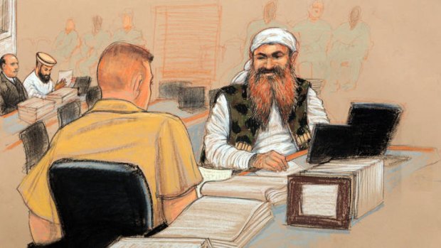 Courtroom sketch of Khalid Sheikh Mohammed, right, speaking to his lawyer during the hearing.