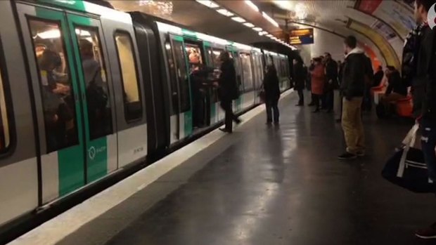 A video grab shows Chelsea football fans packed on to a Paris Metro train pushing a black man to prevent him from boarding.