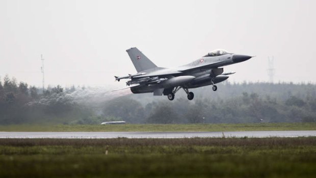 One of the seven Danish F-16 fighter jets takes off from Flyvestation Skrydstrup military airport.