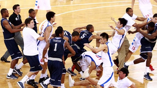 Players from Georgetown University and Bayi Rockets trade blows.